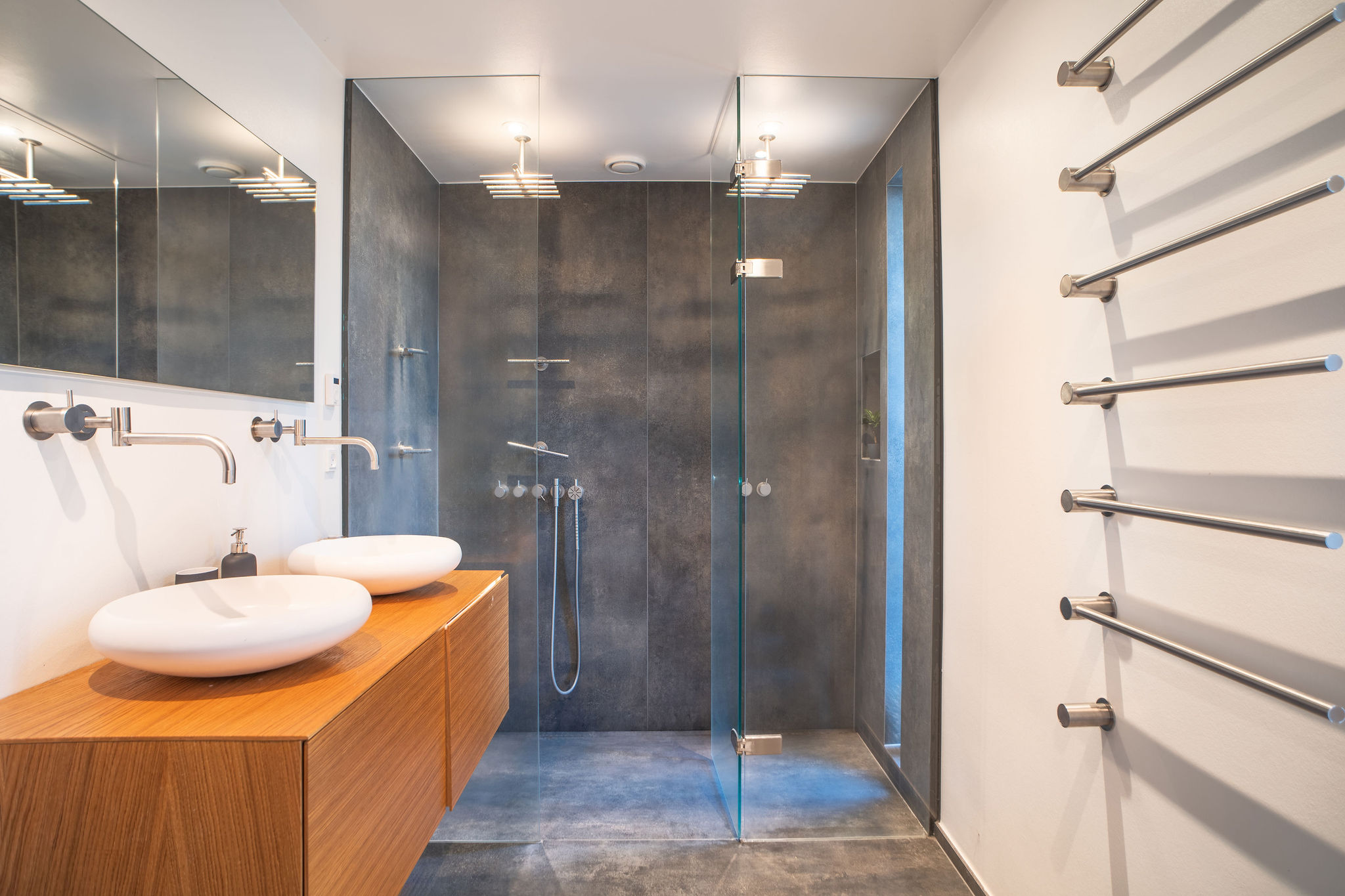 a bathroom with a shower and sink