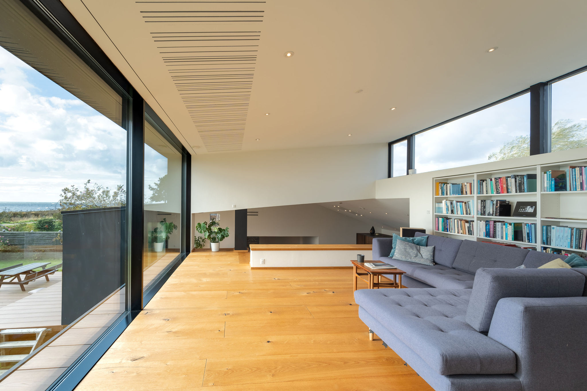 a living room with a couch and a bookcase